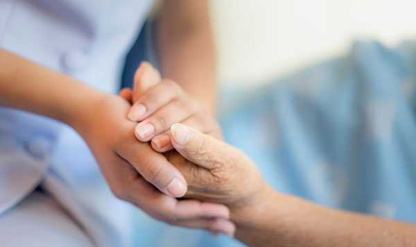 Compassionate hands connecting across generations.